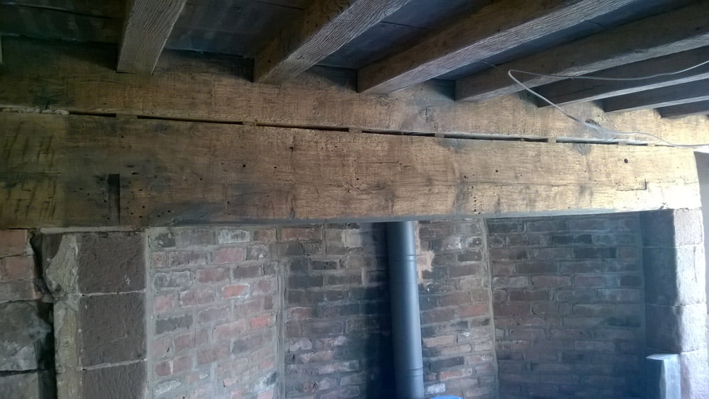 17th Century farmhouse beam cleaning before